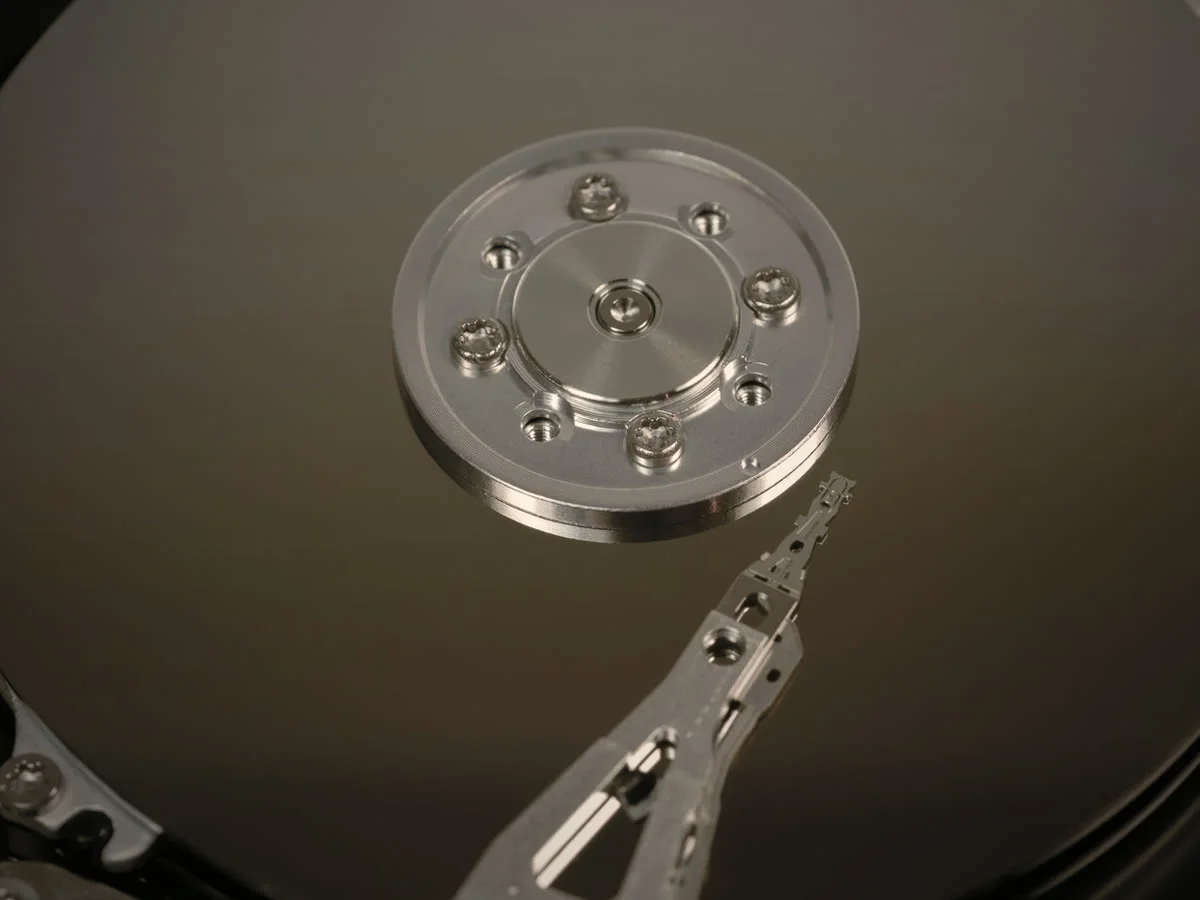 Close-up of a hard drive platter and read arm